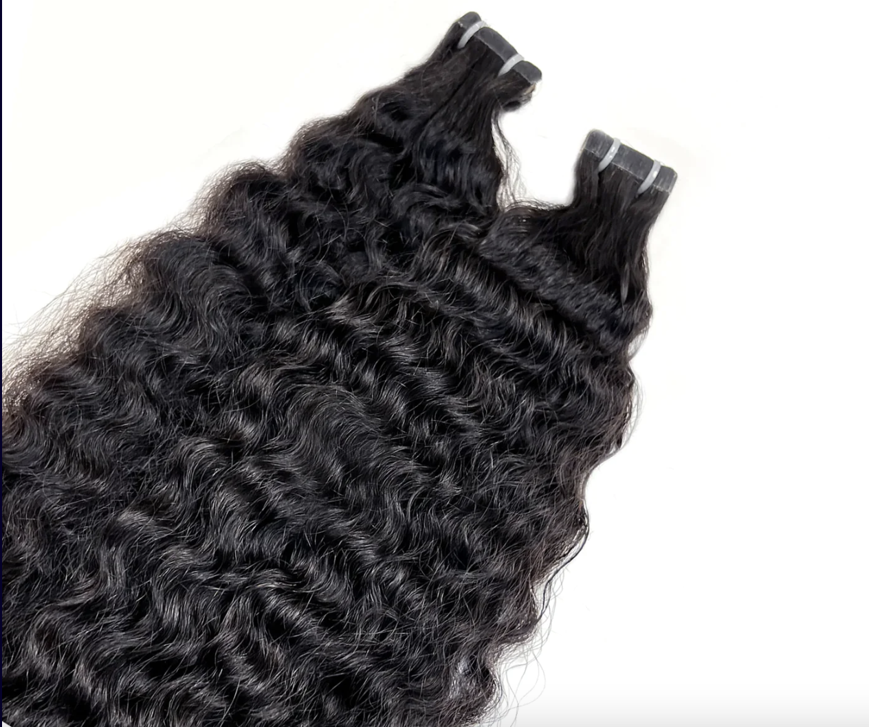 raw indian hair extensions, curly hair extensions, tape-in hair extensions, human hair extensions, curly tape-in extensions, luxury hair extensions, natural curly hair extensions